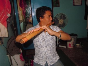 Nirmal Singh playing flute in happier times.